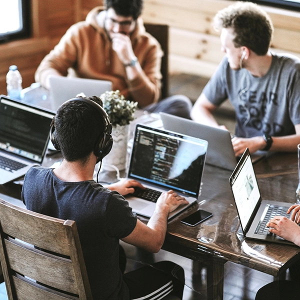 team of web developers working individually on computers